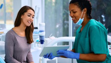 Dentist talking to patient